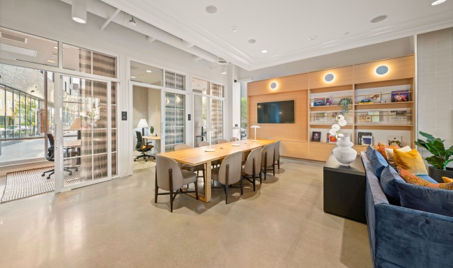 lounge with tv and large table and chairs