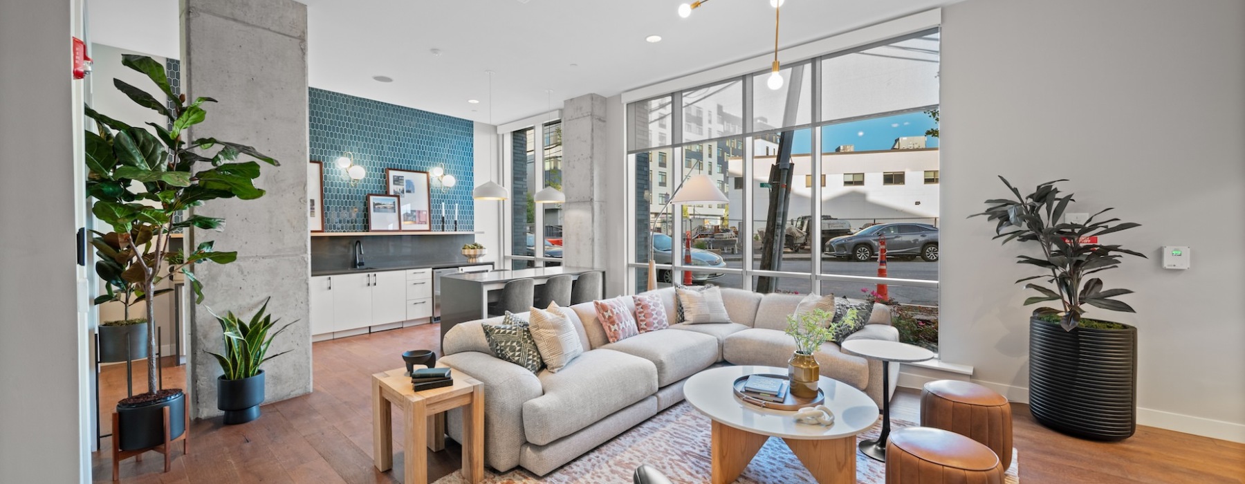 a clubhouse room with a fireplace, a tv and a couch