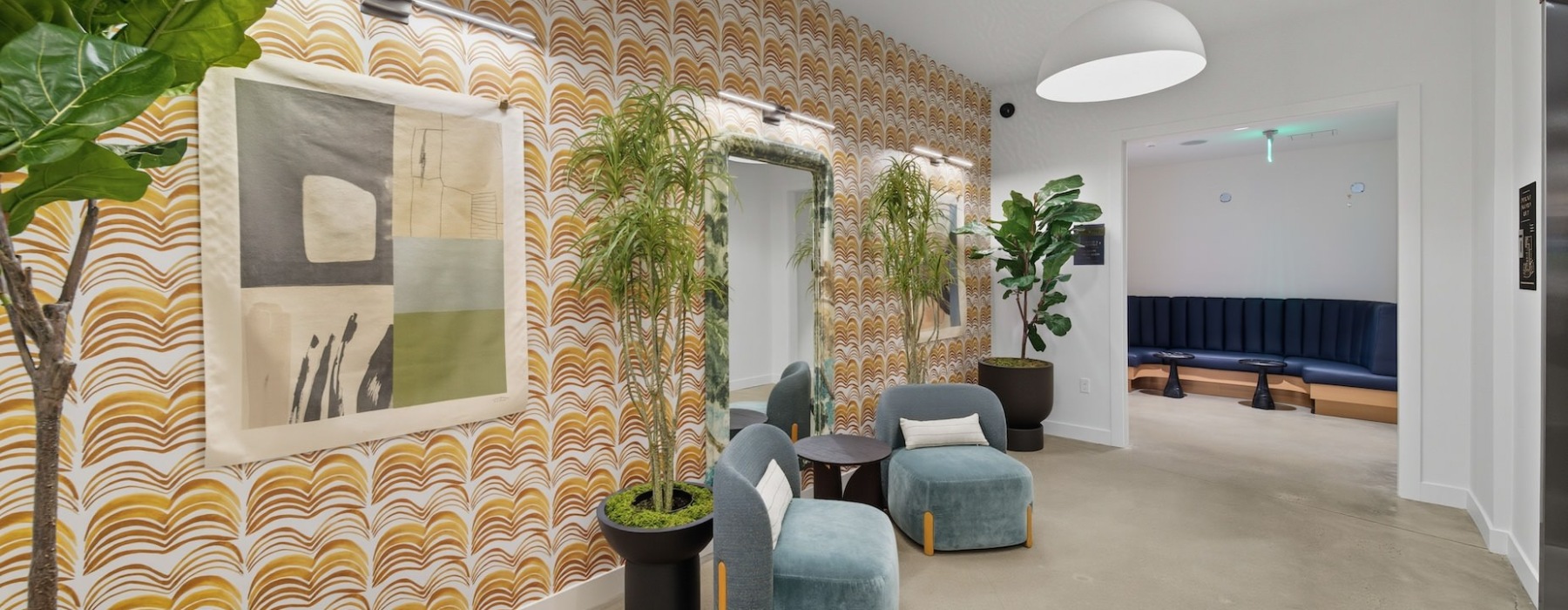 elevator lobby with wallpaper and soft seating